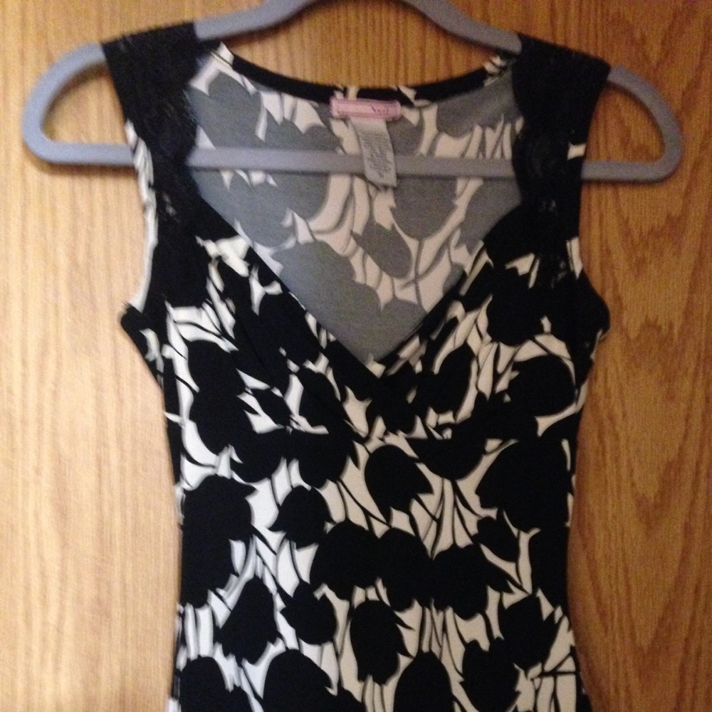 Cream and black top with lace accent